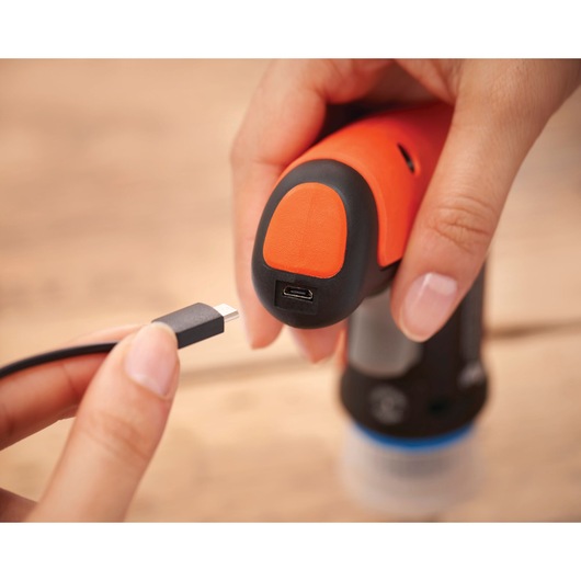 BLACKDECKER BCRTA601I tool close-up showing USB charging port with cable, photography category.