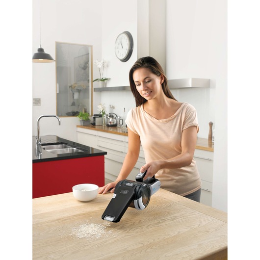 Photo of BLACKDECKER BDH2000PL handheld vacuum cleaning kitchen counter.