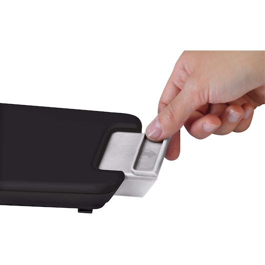 Photo of a hand removing the silver dustbin from BLACKDECKER BDH2000PL vacuum cleaner, close-up on white background.
