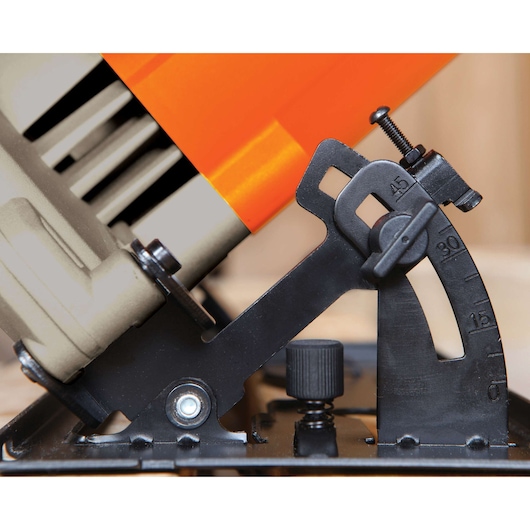 Close-up photo of BLACKDECKER CS1024 angle adjustment mechanism on power tool, showing detailed gauge markings.