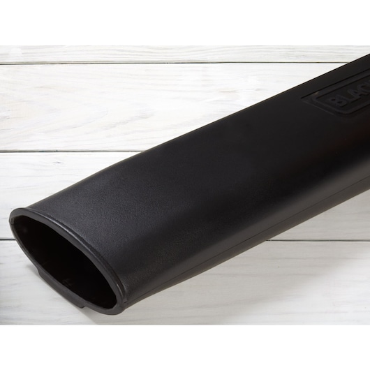 BLACKDECKER LB700 leaf blower nozzle, black plastic, close-up angle on white wood background.