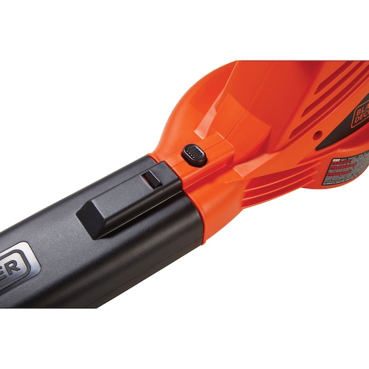 Close-up of BLACKDECKER LB700 leaf blower handle with orange and black plastic body, side view on white background.
